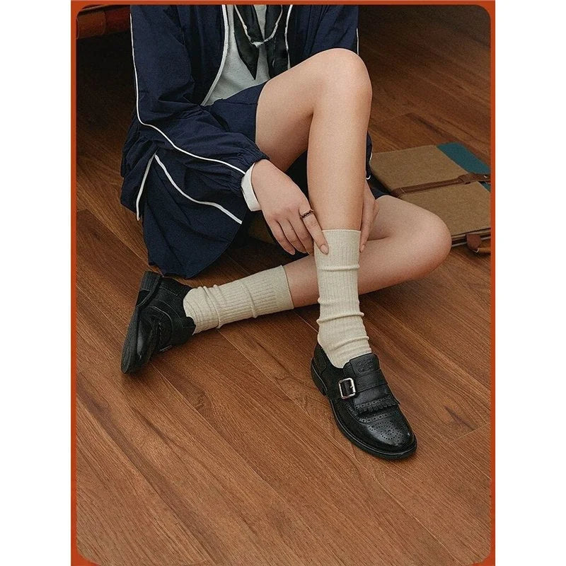 Women's Brogue Loafers with Fringed Cap & Adjustable Buckle - Seated Crossed Legs