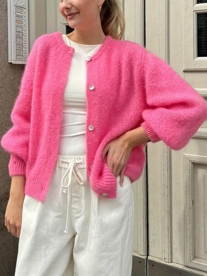 Women's Button-Front Cardigan Sweater with Crew Neck & Long Sleeves - Pink Smiling Pose