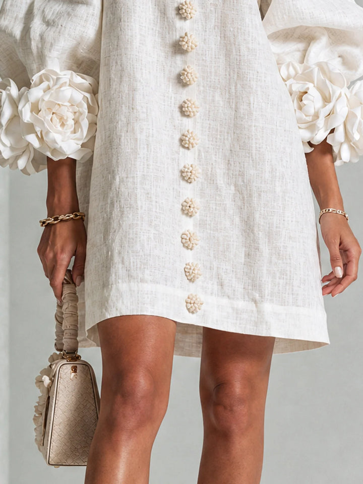 White Women's Floral Mini Dress with Linen Button-Front & Rosette Cuffs — Jolie - Close Up Hem Cream