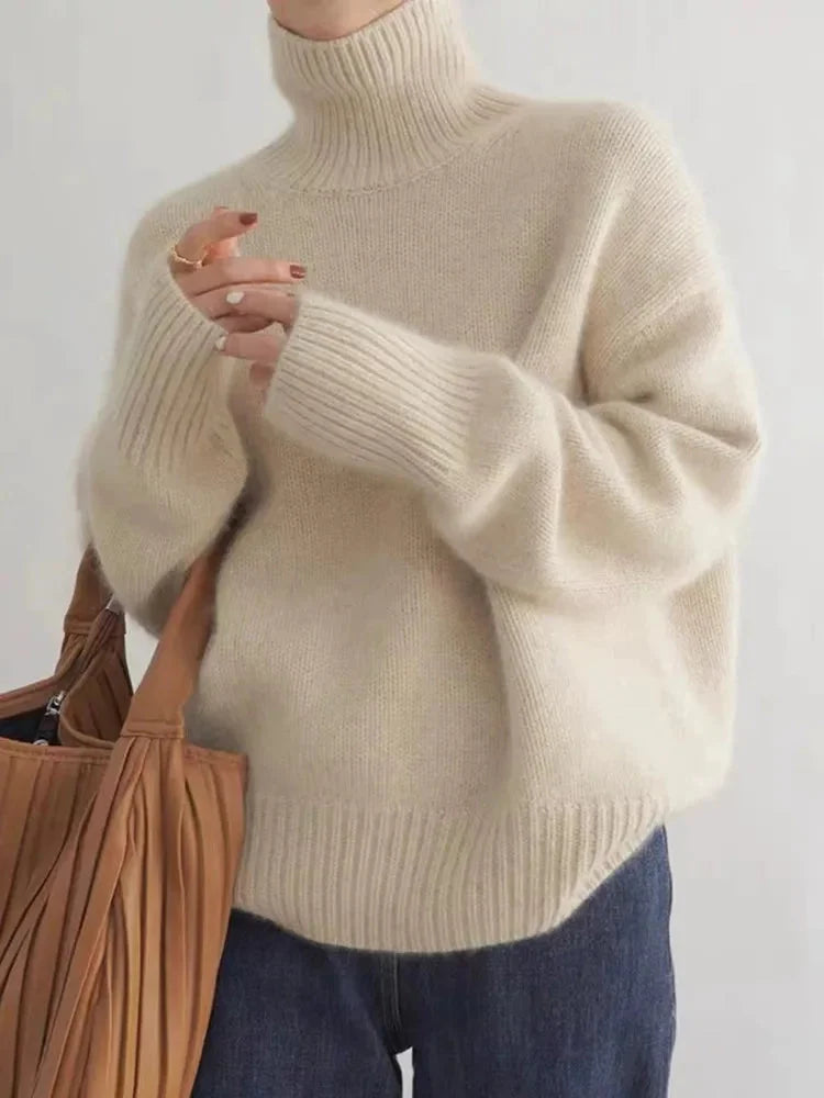 Beige Women's Cashmere Turtleneck Sweater with Ribbed Cuffs & Relaxed Fit - Front Bag Pose