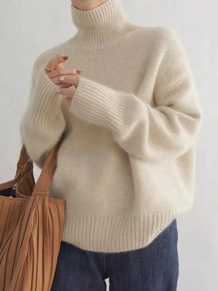 Beige Women's Cashmere Turtleneck Sweater with Ribbed Cuffs & Relaxed Fit - Front Bag Pose