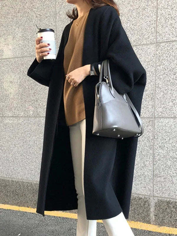 Women's Long Wool Coat with Collarless Neckline & Oversized Sleeves - Worn Open