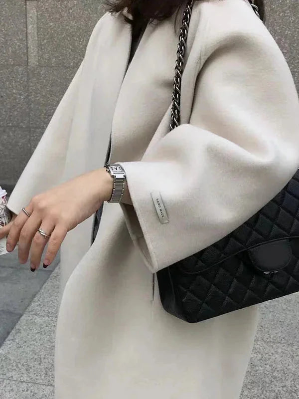 Women's Long Wool Coat with Collarless Neckline & Oversized Sleeves - Sleeve Close Up