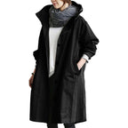 Black Women's Waterproof Raincoat with Hooded Drawstring & Oversized Fit - Front Buttoned Pose