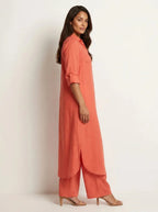 Red Women's Linen Shirt Dress with Rolled Sleeves & Curved Maxi Hem — Edith - Side Profile Walking