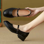 Black Women's Mary Jane Shoes with Leather Finish & Low Block Heel - Hand Holding Detail