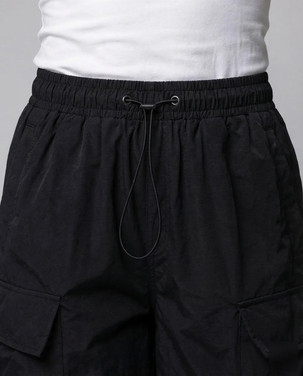 Black Women's Oversized Cargo Pants with Drawstring Waist & Flap Pockets — Lena - Close Up Waistband