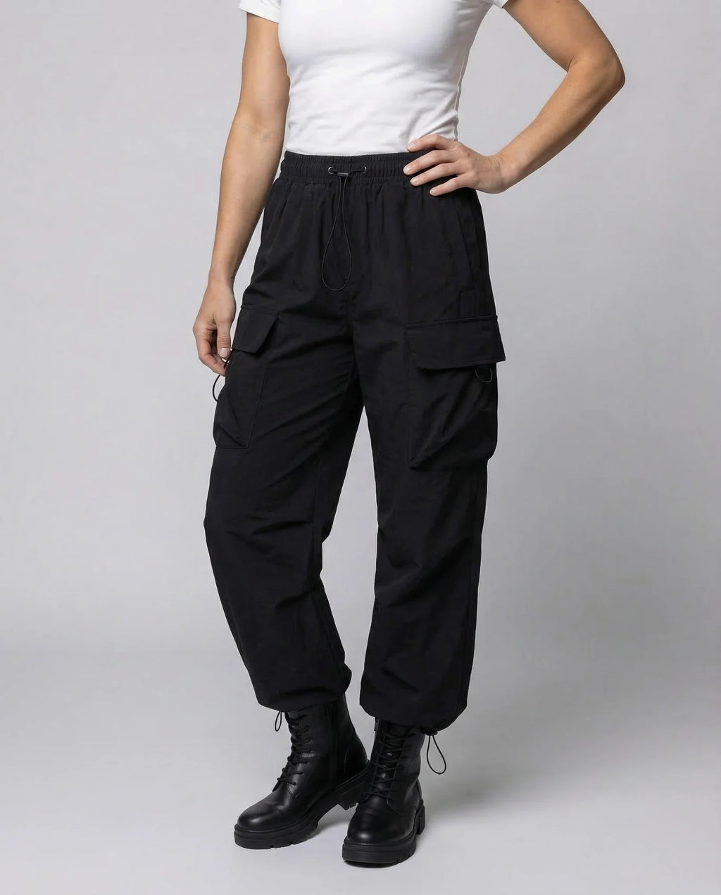 Black Women's Oversized Cargo Pants with Drawstring Waist & Flap Pockets — Lena - Waist Up Pose