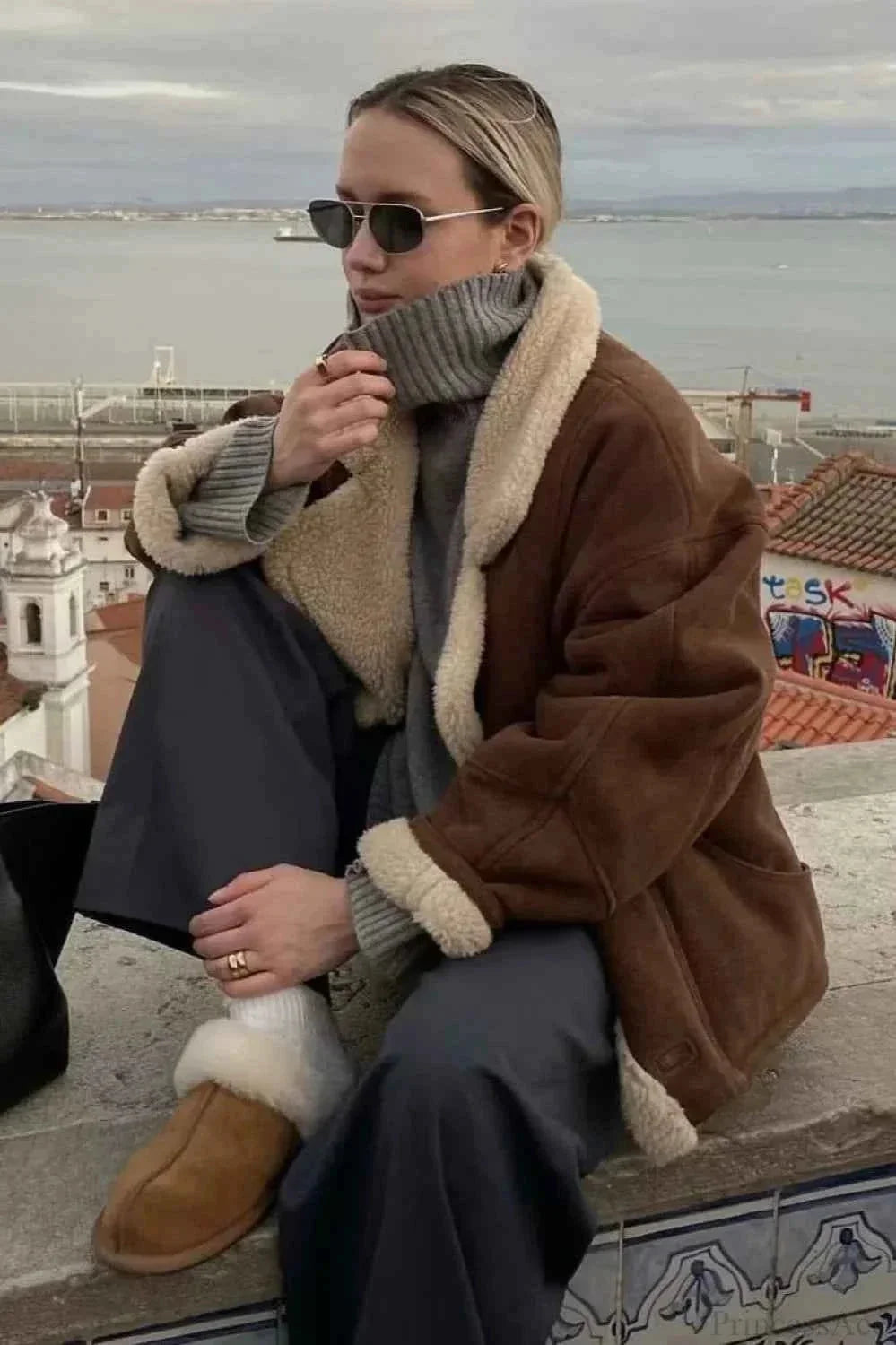 Khaki Men's Sherpa Coat with Oversized Fit, Notched Collar & Patch Pockets - Outdoor Seated Pose