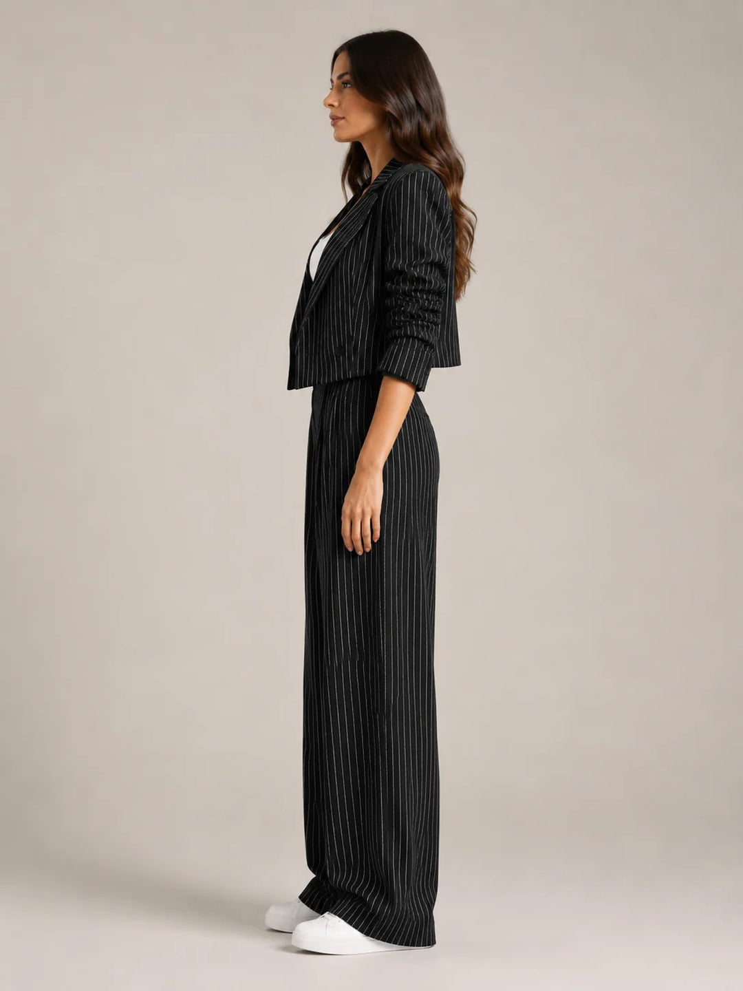 Black Women's Pinstripe Two-Piece Suit with Cropped Blazer & Relaxed Wide-Leg Pants — Beatrice - Side Profile