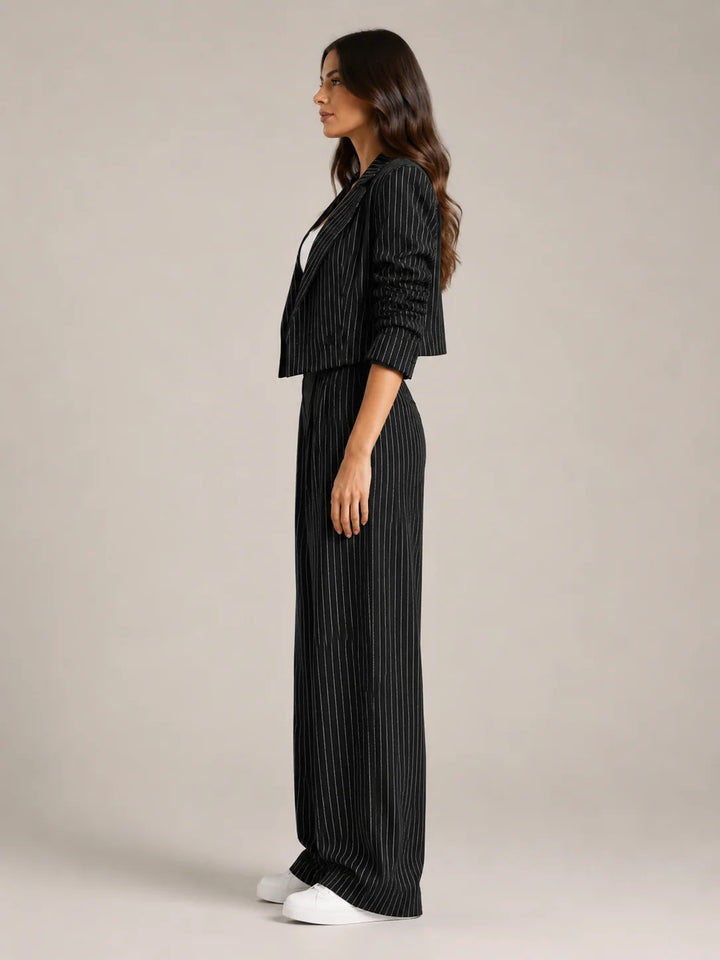 Black Women's Pinstripe Two-Piece Suit with Cropped Blazer & Relaxed Wide-Leg Pants — Beatrice - Side Profile
