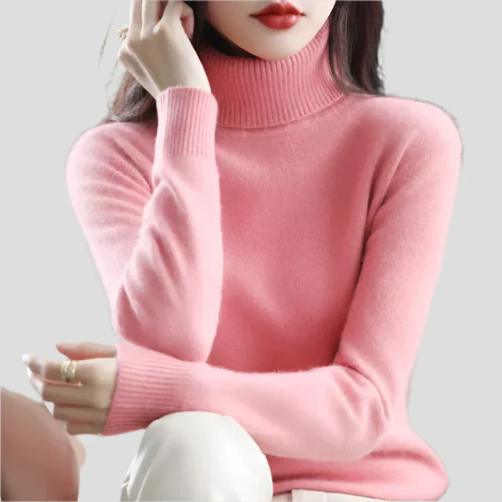 Pink Women's Ribbed Turtleneck Sweater with Fitted Silhouette for Cozy Layering - Seated Pose