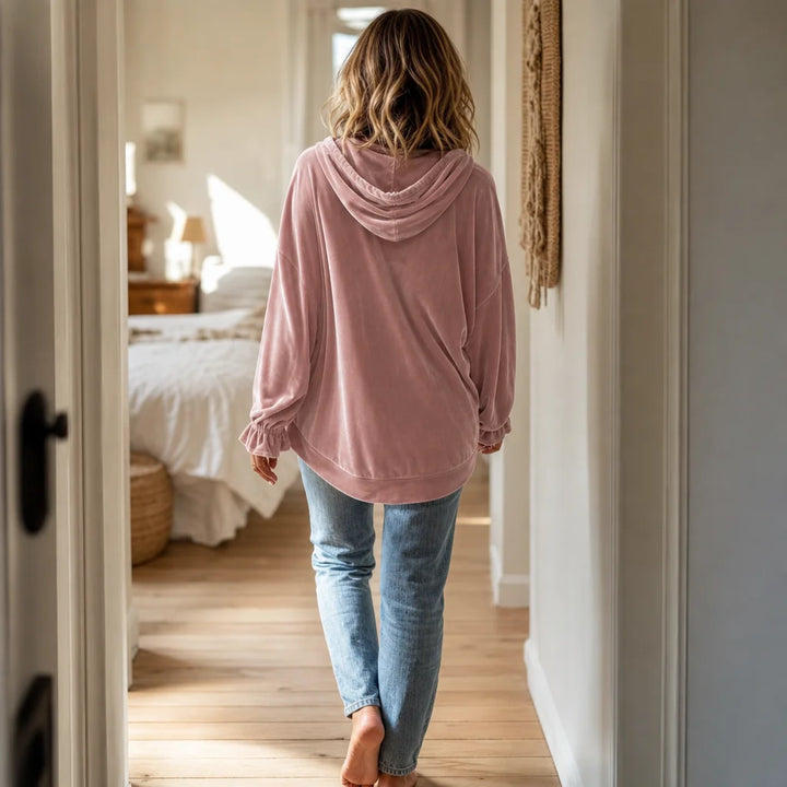 Pink Women's Velvet Hoodie with Drawstring Hood & Gathered Cuffs — Rita - Back Walking Hallway