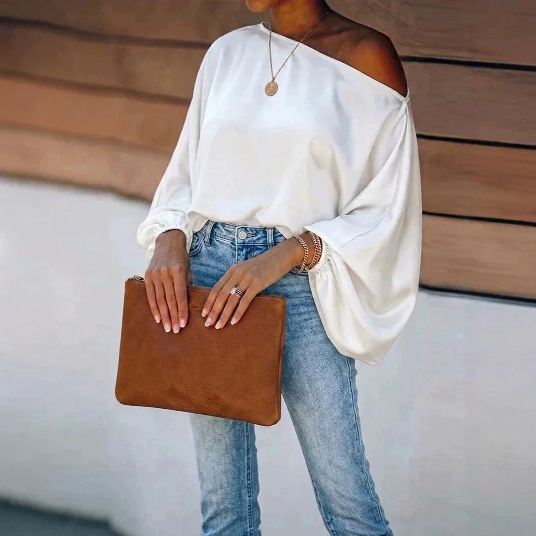 White Women's Satin Blouse with Asymmetric Off-Shoulder Neckline & Batwing Sleeves - Front View Clutch