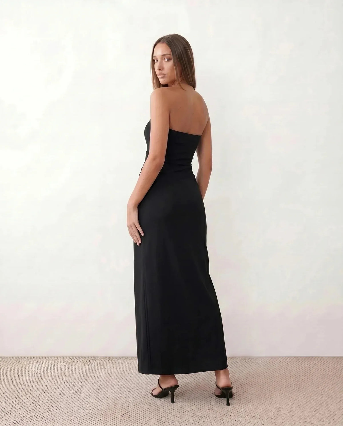 Black Women's Strapless Maxi Dress with Ruched Waist & Side Slit — Renee - Back Pose