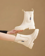 Beige Women's Waterproof Chelsea Boots with Knit Ankle Cuff & Pull Tabs — Siobhan - Held Up Pair Detail