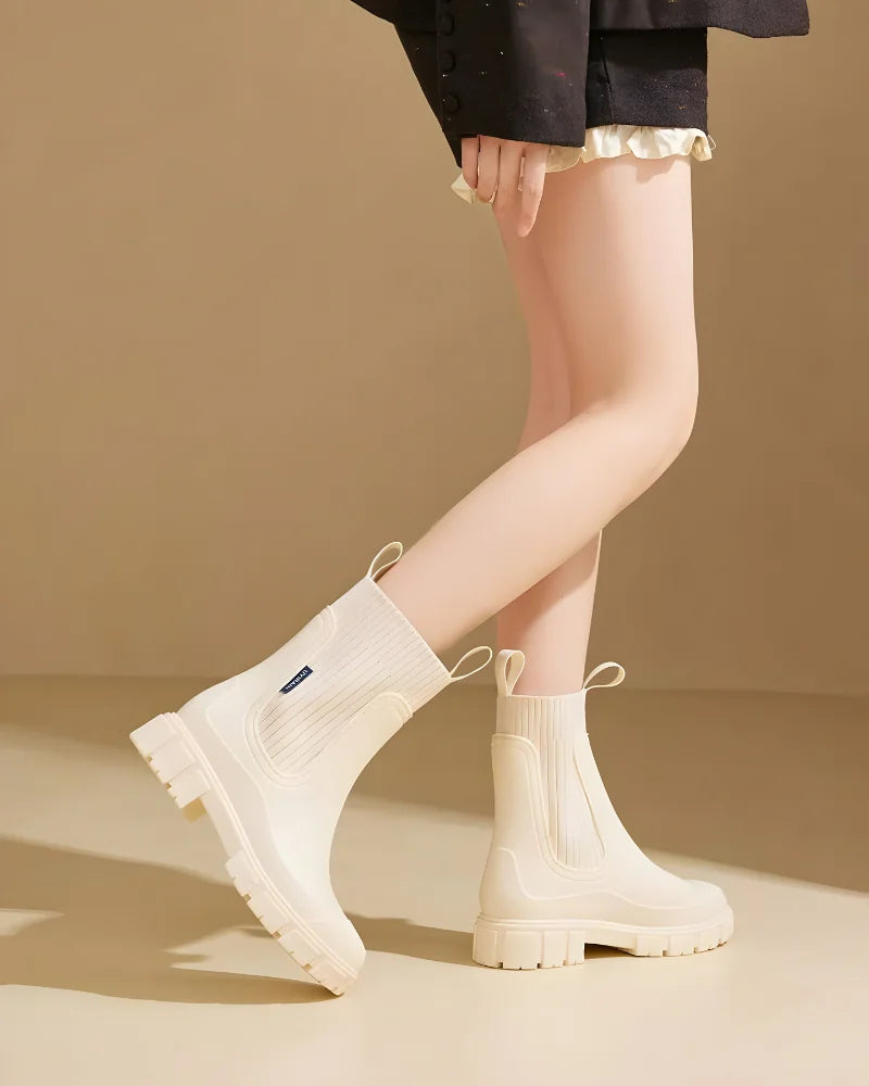 Beige Women's Waterproof Chelsea Boots with Knit Ankle Cuff & Pull Tabs — Siobhan - Side Profile Walking