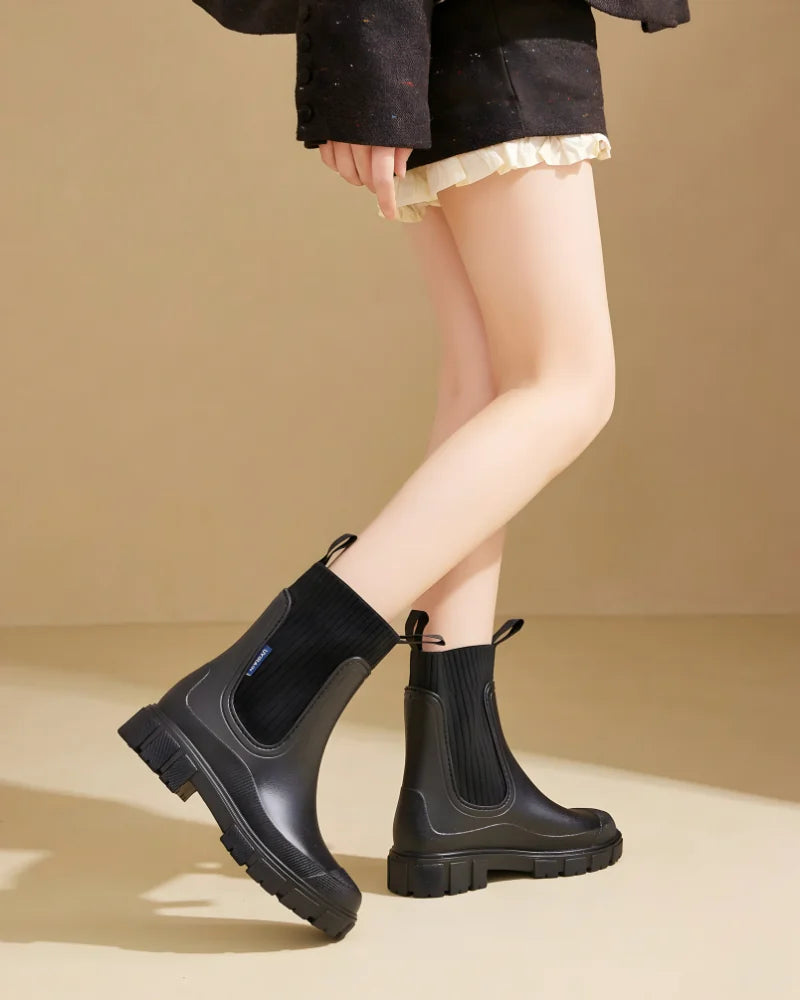Black Women's Waterproof Chelsea Boots with Knit Ankle Cuff & Pull Tabs — Siobhan - Model Walking Motion