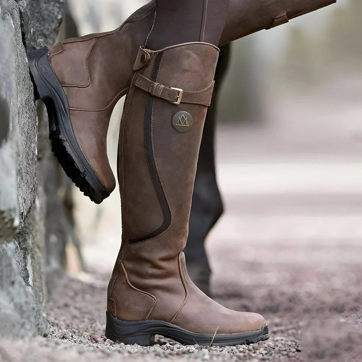 Dark Brown Women's Waterproof Leather Knee-High Boots with Buckle Strap & Elastic Gusset — Issy - Leaning Wall Pose
