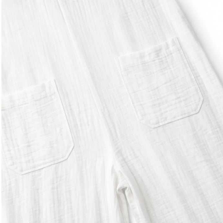 White Women's Wide Leg Jumpsuit in Crinkle Linen with Button-Front Collar — Halle - Close Up Pockets
