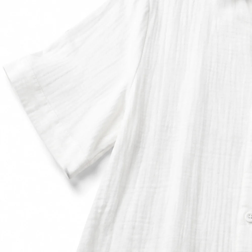White Women's Wide Leg Jumpsuit in Crinkle Linen with Button-Front Collar — Halle - Close Up Sleeve